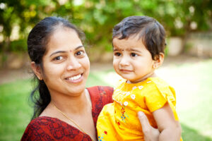 Indian mother with her little daughter showing affection